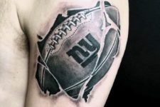 Awesome football tattoo on the biceps