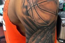Ball and clasped hands in prayer tattoo