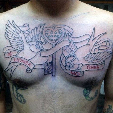 Birds and key tattoo on the chest