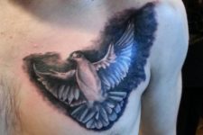 Black and white dove tattoo on the chest