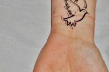 Black-contour tattoo on the wrist