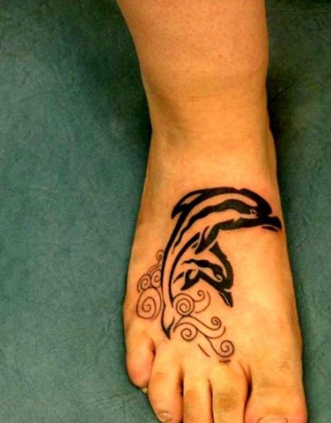 Black tattoo on the foot