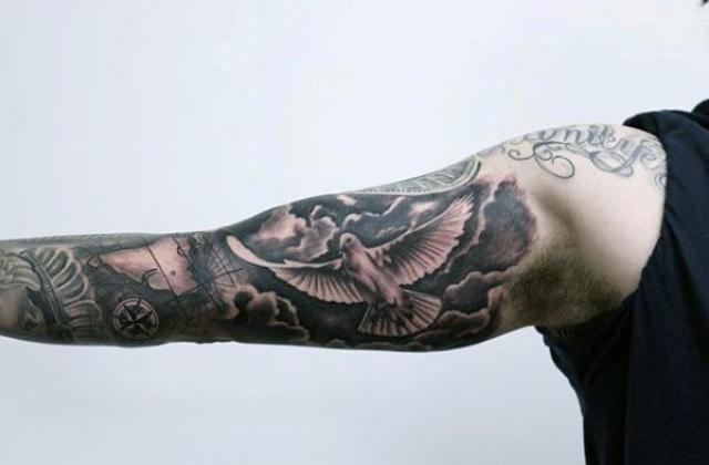 Black, white and marsala colored sky and dove tattoo