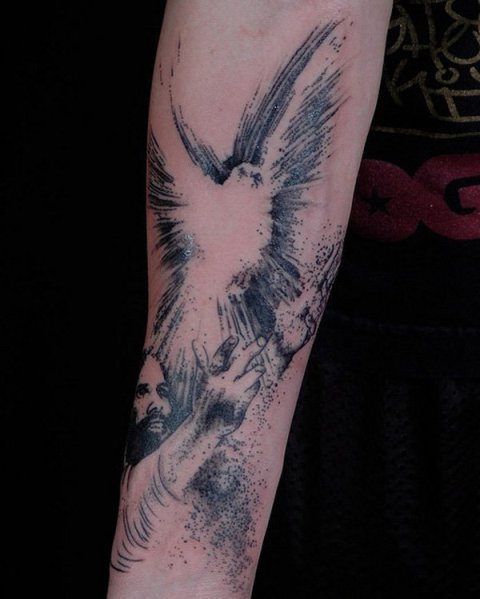 Blue colored dove and Christ tattoo