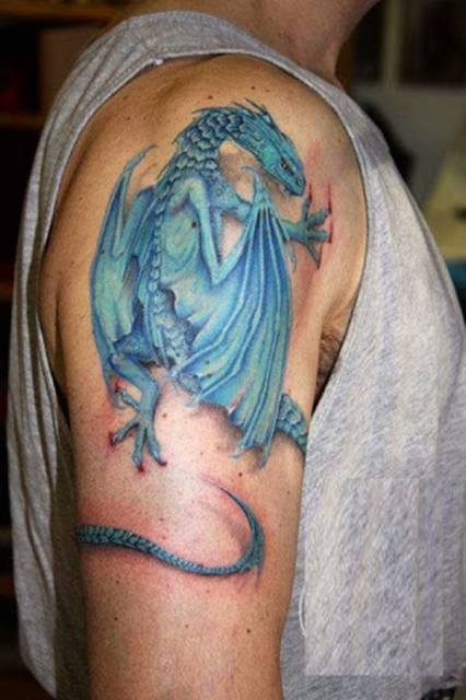 Blue dragon tattoo on the arm