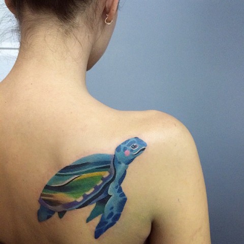 Blue, yellow and green turtle tattoo