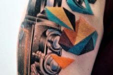 Camera with colorful geometric elements tattoo