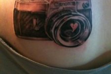 Camera with red heart tattoo on the back