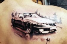 Car and forest tattoo on the back