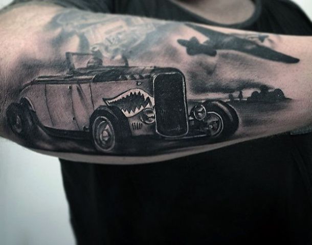 Car and plane tattoo on the forearm
