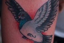 Cartoon dove tattoo on the arm