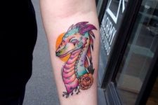 Cartoon dragon tattoo on the forearm