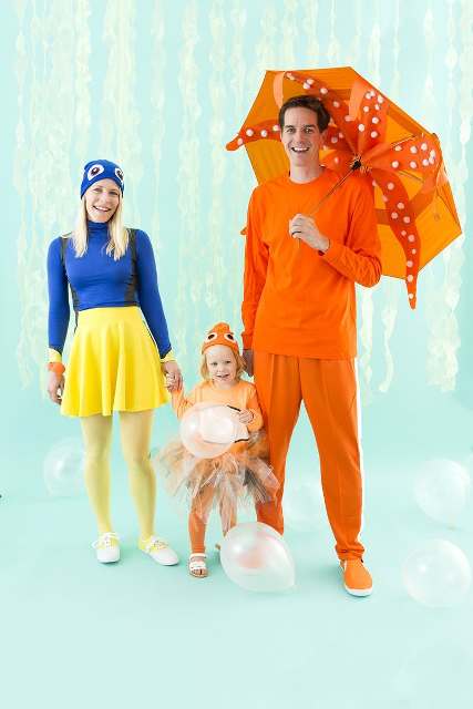 a blue fish costume for the mom, an orange octopus for the dad and a little orange fish cotume for the girl
