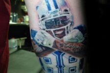 Colorful football player tattoo