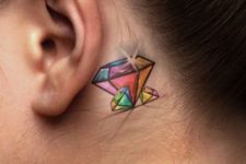 Colorful tattoo behind the ear