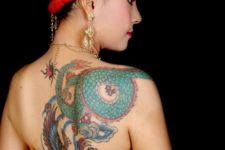 Colorful tattoo on the back and shoulder