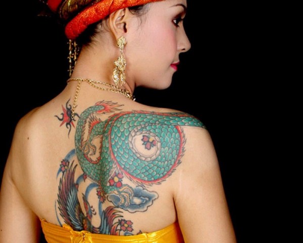 Colorful tattoo on the back and shoulder