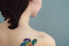 Colorful turtle tattoo design on the shoulder
