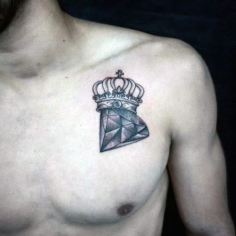 Crown and diamond tattoo on the chest