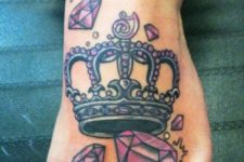 Crown and diamonds tattoo on the foot