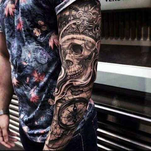 Crown and skull tattoo on the arm