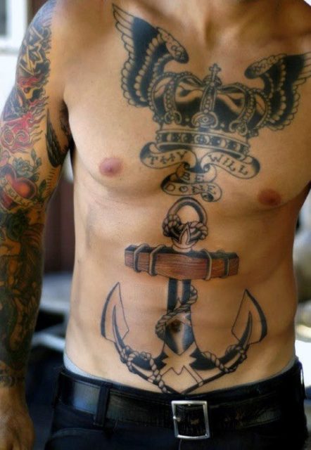 Crown, wings and anchor tattoo on the chest and stomach