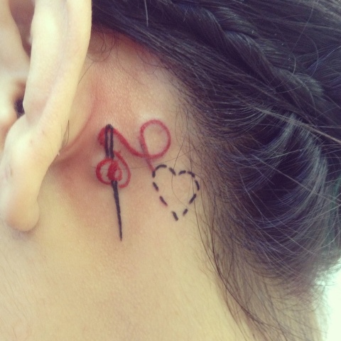 Cute tattoo behind the ear