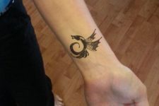 Cute tiny tattoo on the wrist