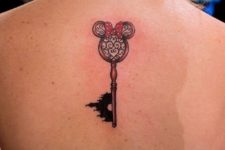 Disney styled key tattoo on the back