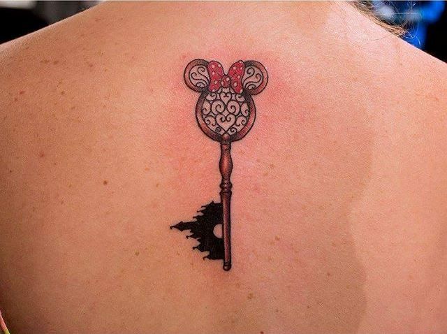 Disney styled key tattoo on the back