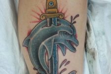 Dolphin and sword tattoo