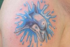 Dolphin and water splashes tattoo