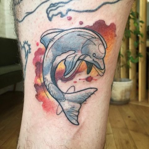 Dolphin tattoo idea on the leg