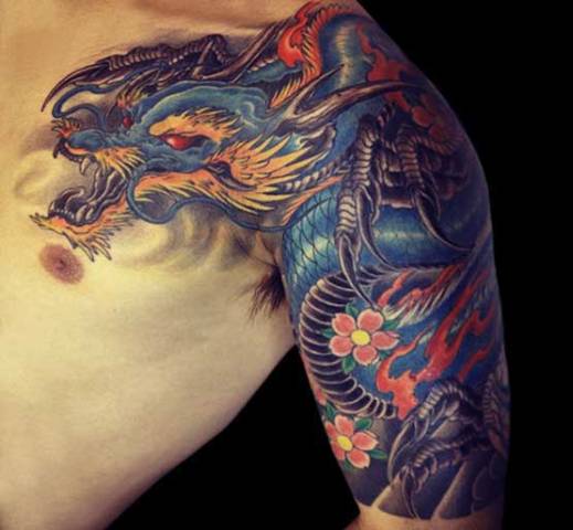 Dragon and flowers tattoo on the hand