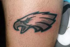 Eagles logo tattoo on the arm