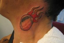 Football with flame tattoo on the neck