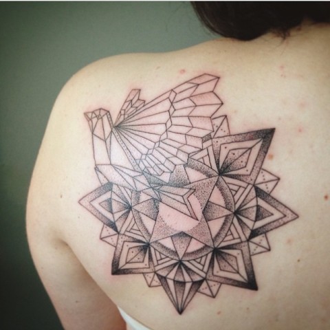 Geometric dove tattoo on the shoulder