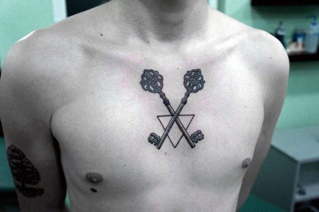 Geometric two keys tattoo on the chest