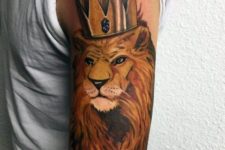 Gorgeous lion and crown tattoo