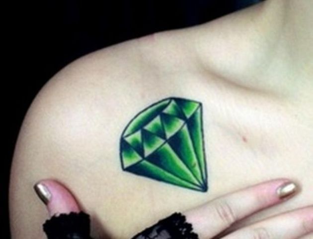 Green diamond tattoo on the shoulder