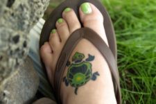 Green turtle tattoo on the foot