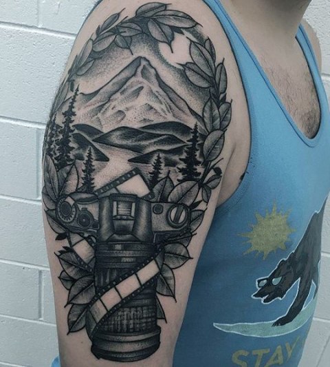 Half-sleeve nature and camera tattoo