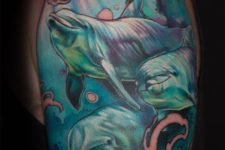 Half-sleeve tattoo with several dolphins