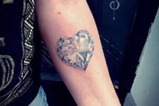 Heart shaped diamond tattoo on the forearm