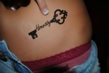 Key with word ‘honesty’ tattoo