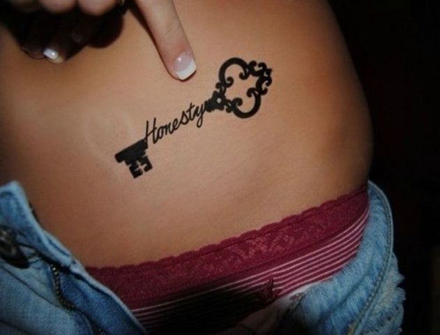 Key with word 'honesty' tattoo