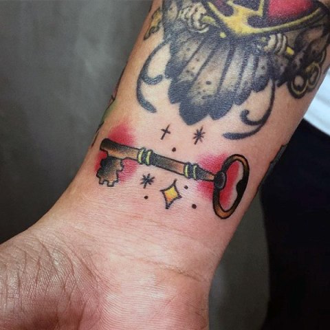 Magic key tattoo on the wrist