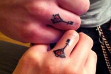 Matching tiny tattoos on the fingers