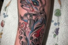 Pirate dolphin tattoo on the arm