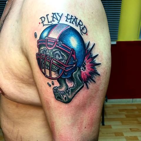 Play hard tattoo on the shoulder
